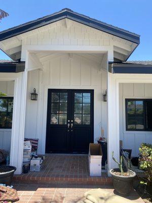 Beautiful front elevation w 8' iron doors, steel casement windows and James Hardie custom siding