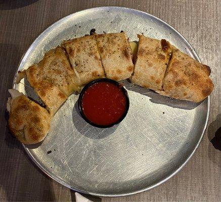 Large Stromboli served with marinara sauce.