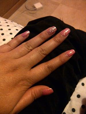 Pink shellac polish with white glitter and heart jewel design