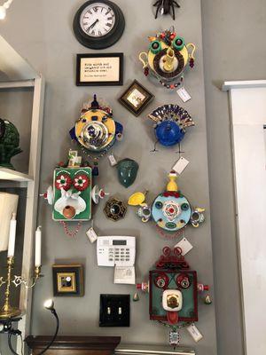 Quirky one-of-a-kind clocks hanging just inside the entrance.