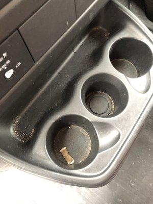 Used tobacco packet spit into cup holder