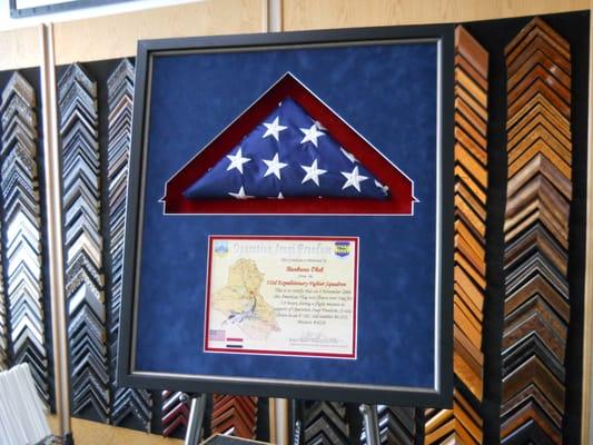 An American flag and documentation framed in a shadow box at Frame It!