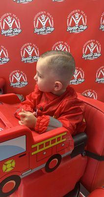 Fire truck chairs and cape, first haircut certificates, awesome with kids!