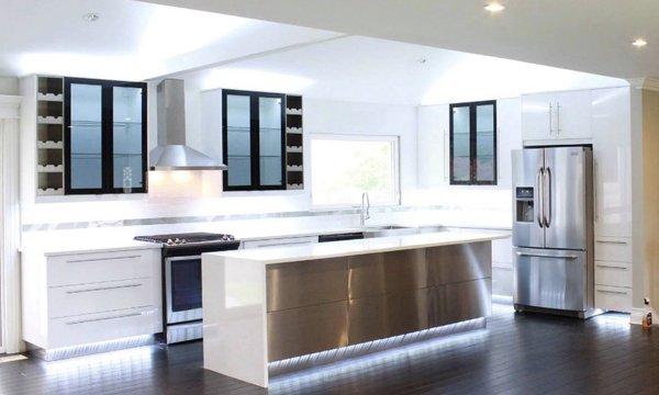 Sleek white quartz on high gloss white cabinets