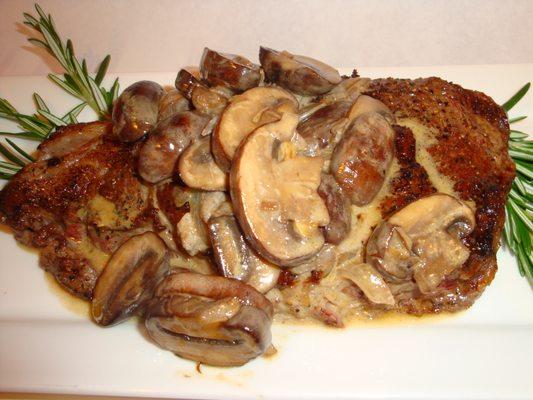 Ribeye Steak with baby bella mushrooms in a cognac & sherry cream sauce