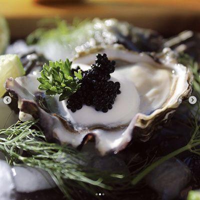 A Southern Florida tradition. Dirty Oysters. Black caviar with a dollop of creme fresh.