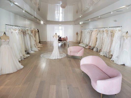 Interior of the LBR Bridal salon, showcasing some of our beautiful gowns and a relaxing sitting area.