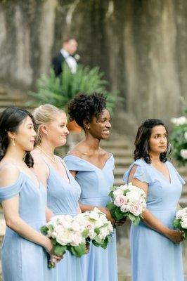 Floor-length bridesmaids dresses in periwinkle and lux chiffon by Bella Bridesmaids. Photo by Leigh Wolfe Photography.