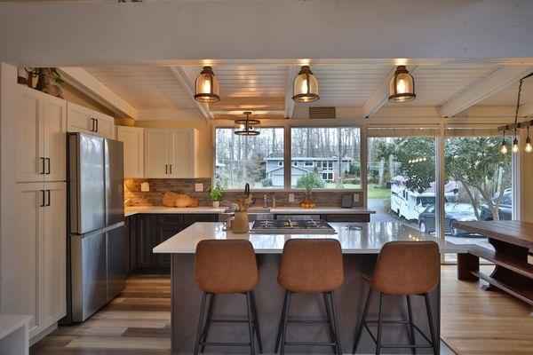 Kitchen remodel with white granite countertop and stainless steel appliances