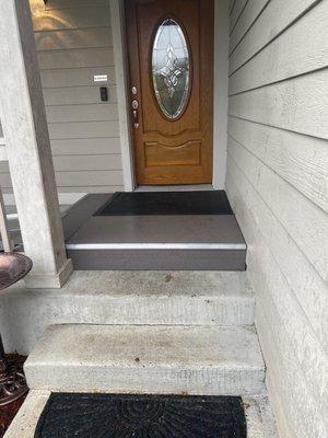 Arlighton porch cover and aluminum ramp with a wood and concrete ramp .