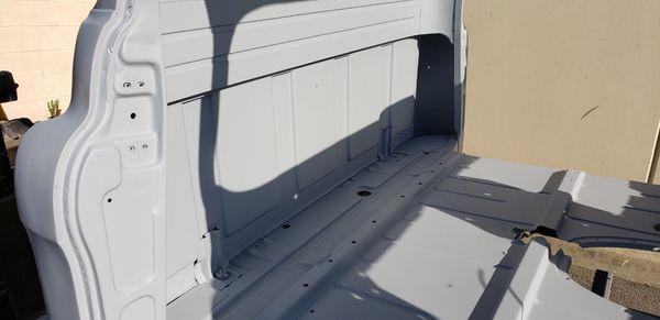 Inside of truck cab after blasting and primer coating applied.