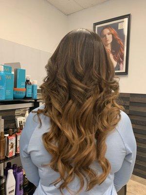 This clients hair is up to her shoulders but you can't tell with a little help from extensions!