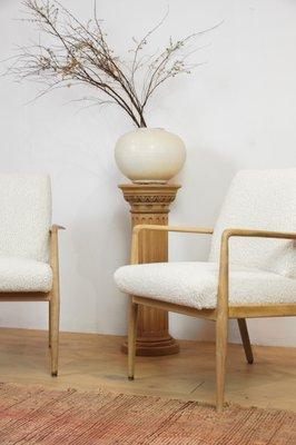 Pair of bleached Danish Mid-Century chairs in off-white shearling.