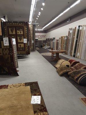 Area rugs on the left, and bound-edge remnants on the right.