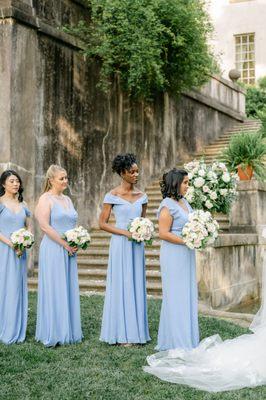 Floor-length bridesmaids dresses in periwinkle and lux chiffon by Bella Bridesmaids. Photo by Leigh Wolfe Photography.