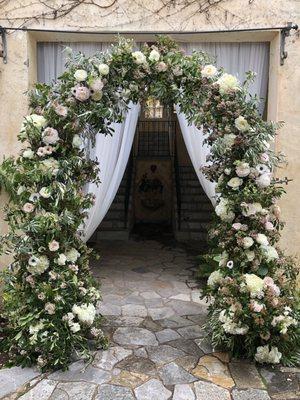 The custom arch built for me by Manny, covered in flowers.