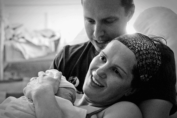 1 minute after birth, a new family meeting one another in loving bliss. A birth I attended as both a doula and photographer.