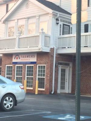 Entrance underneath the Farmer's Insurance sign. Go in the door and veer left.