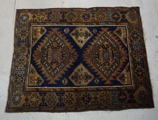 Semi-Antique Caucasian  Navy blue gold and brown. size is approximately 3ft by 5ft