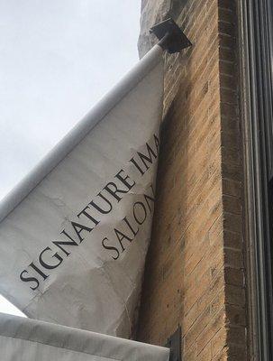 Sign falling