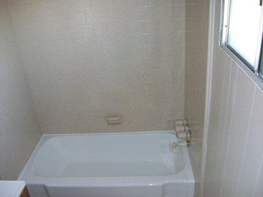 Porcelain tub & Tile enclosure (after) Tub reglazed in glossy white. Tile enclosure in almond speckle finish