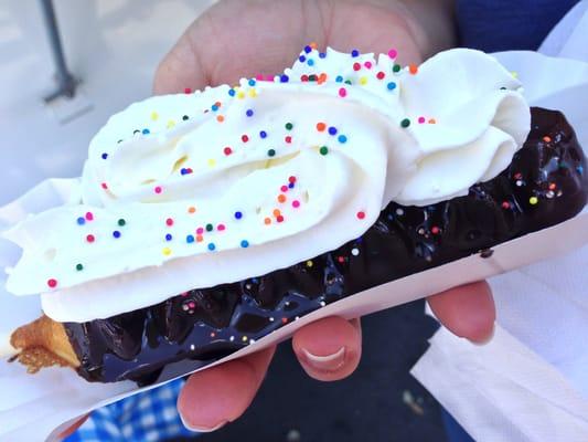 Fudge Puppy (Belgian waffle on a stick with chocolate sauce, whipped cream and sprinkles) from Looie's