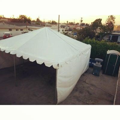 our 20ftx20ft tent with a portable restroom an a hand washing station