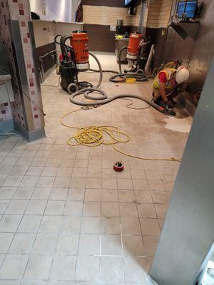 Initial prep stage of Urethane Cement over quarry tile in commercial kitchen.