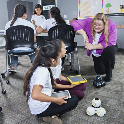 The teacher is checking in to encourage these amazing students. They really didn't need help as they were teaching each other.