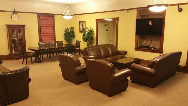 Lounge room showing TV setup. Can be an informal gathering area.