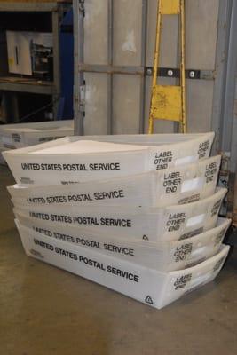 Trays of mail to take to the post office.