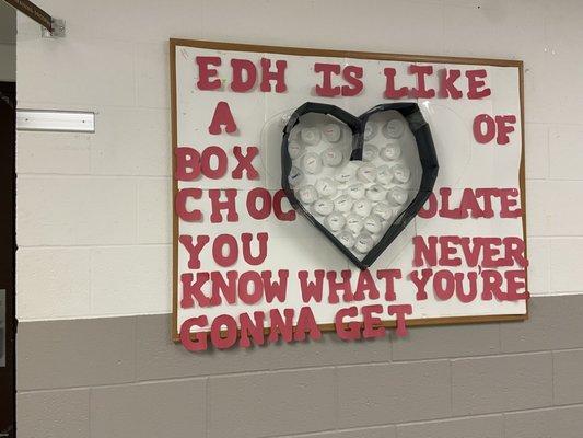 A bulletin board from the Enhanced Day Habilitation program that says: EDH is like a box of chocolate. You never know what you're gonna get.