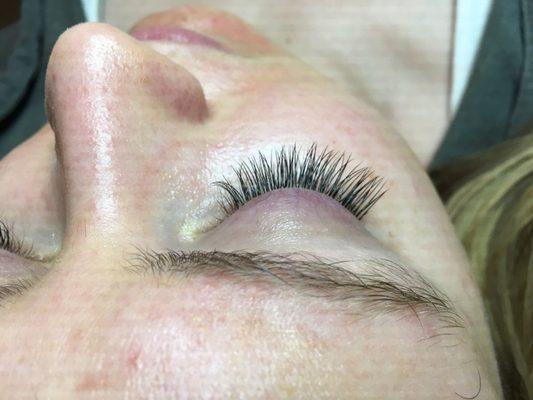 Classic eyelash extensions are perfect for a natural everyday look! No mascar needed! Book today!