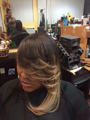 Pressed hair with partial weave.