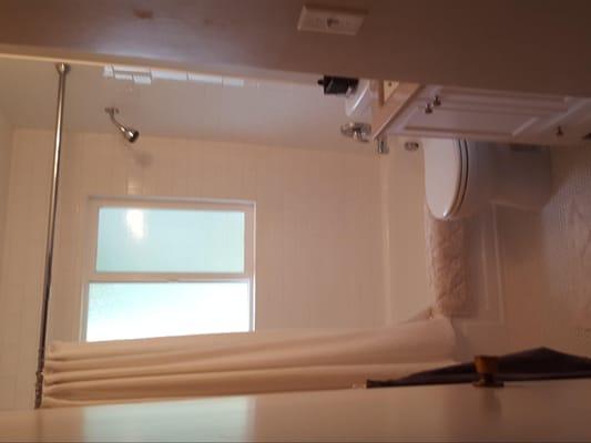 Recent bathroom remodel. New tile in the tub area and floor. Refinished tub.