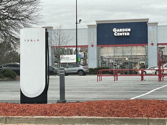 A pull-thru charging spot for vehicles pulling a trailer.