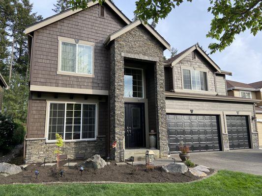 He painted the house, garage door, and front door.