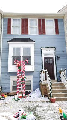 Our client wanted the shutters to match the front door so we replaced them in the next photo.