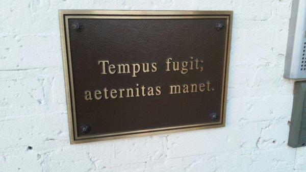 Latin inscribed plaque outside of building