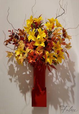 Luxe silk lilies surrounded by fall foliage