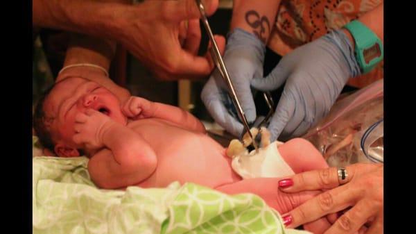 Rachel helping dad cut little one's cord!