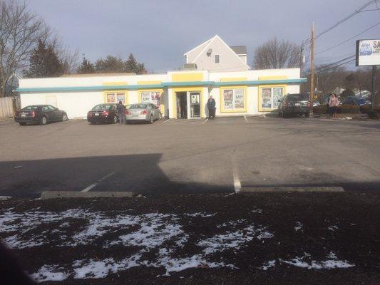 The guy standing outside guarding his 1/3 full parking lot.