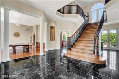 Grand entrance of Oak Stairs inside the beautiful estate home in Beacon Hill, Leesburg