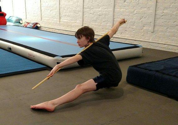 Wushu/Kung Fu student working on his flexibility, endurance, and conditioning.