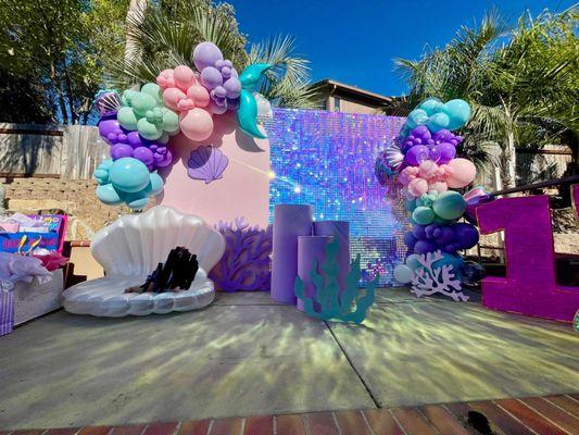 Balloons, back drop, cake stands, underwater themed props