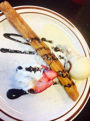 Giant churro comes with ice cream and strawberry filled, delicious!