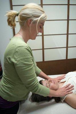 Feeling the pulse of the Craniosacral Rhythm at the shoulders.