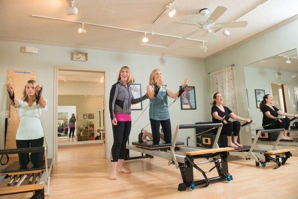 Small group classes are the most ideal way to learn Pilates where clients have an opportunity to ask questions in a fun community atmosphere