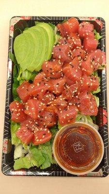 Poki Special: fresh tuna cubes covered in our delicious poki sauce on a bed of crisp romaine lettuce, served with avocado and sauce.