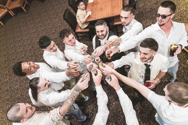 Groom and groomsmen cheering